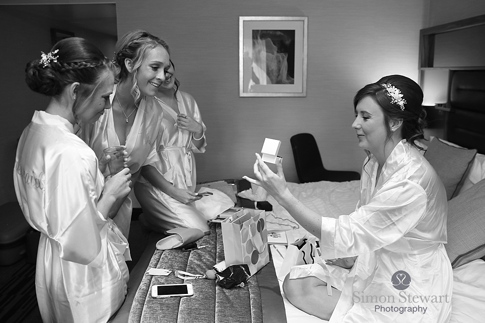 Bride opening a present at the Felbridge Hotel