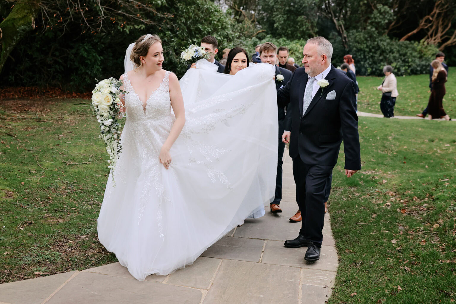Guests throwing confetti outside Highley Manor after the winter ceremony