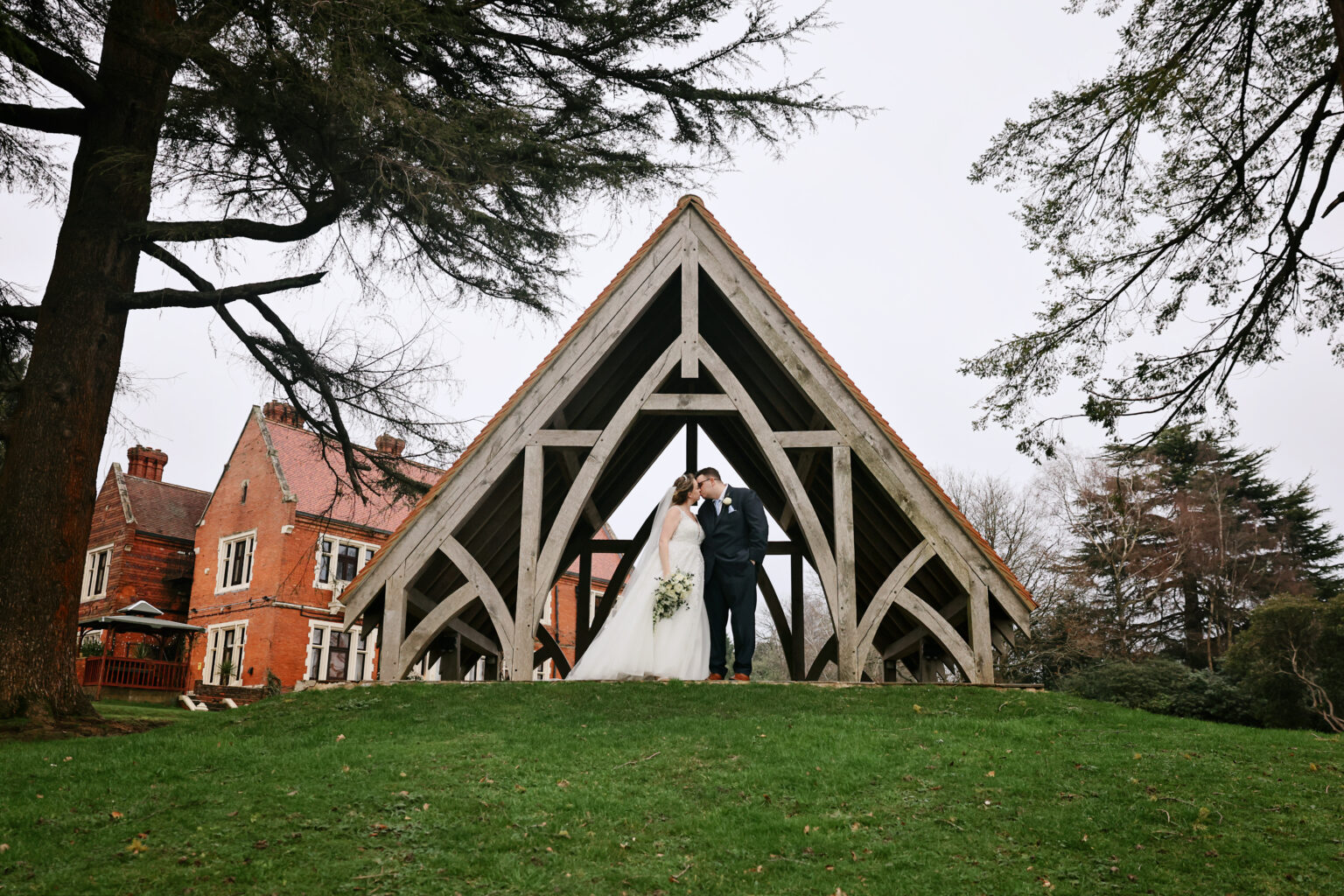 Romantic winter couple portrait in the gardens at Highley Manor