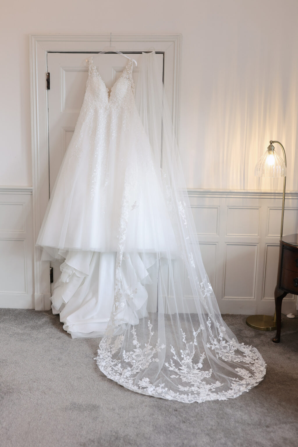 Bride getting ready on a February wedding morning at Highley Manor in Sussex