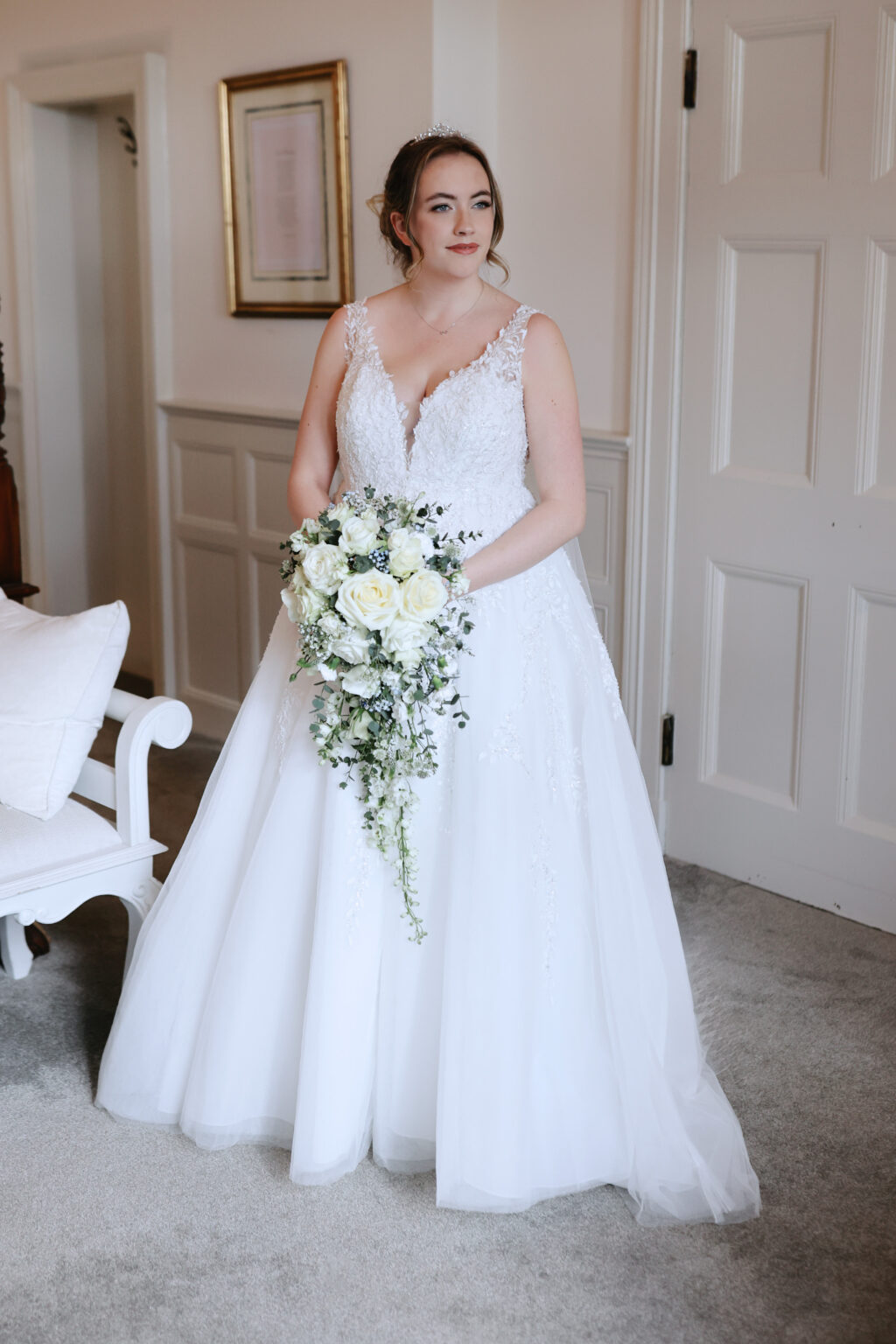 Bride getting ready on a February wedding morning at Highley Manor in Sussex